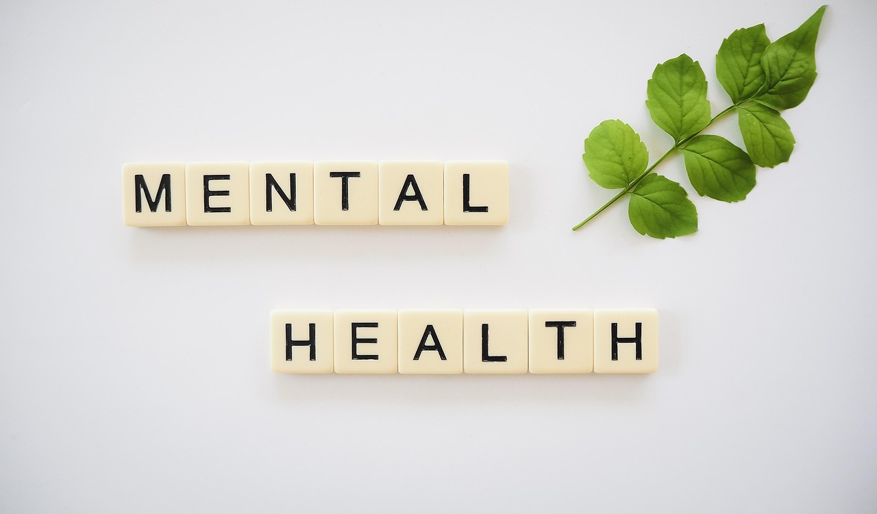 scrabble letters spelling out the word 'mental health'